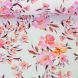 Cotton Jersey - Whimsical Blossoms - Pink/Orange Blossoms on pale blue background - by Swafing